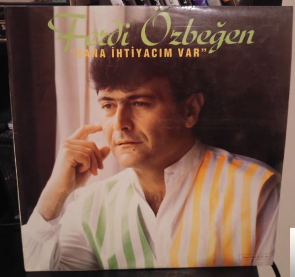 دانلود آهنگ Bir Dünya Düşün - Ferdi Özbeğen از Ferdi Özbeğen